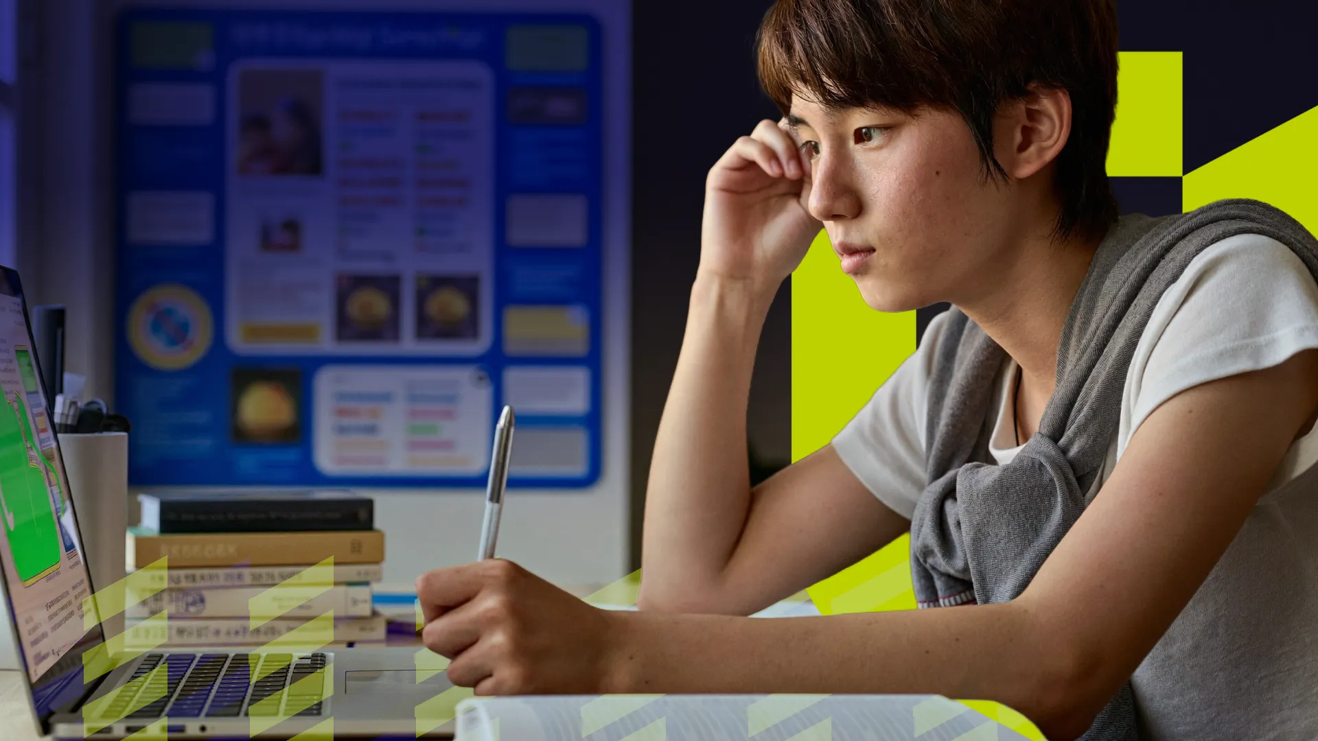 A student taking notes during a live online class